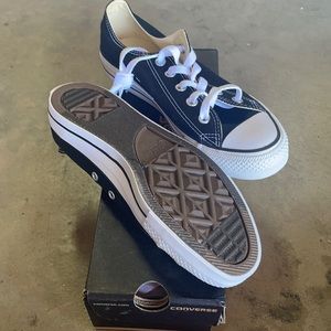 Brand new black and white converse shoes.